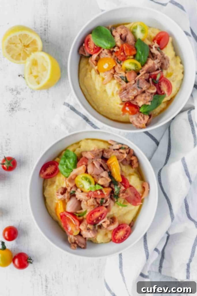 This vegan grits recipe is the perfect gluten-free meal! Creamy vegan polenta cooked in coconut milk is topped with savory jackfruit confit with tomatoes and basil!