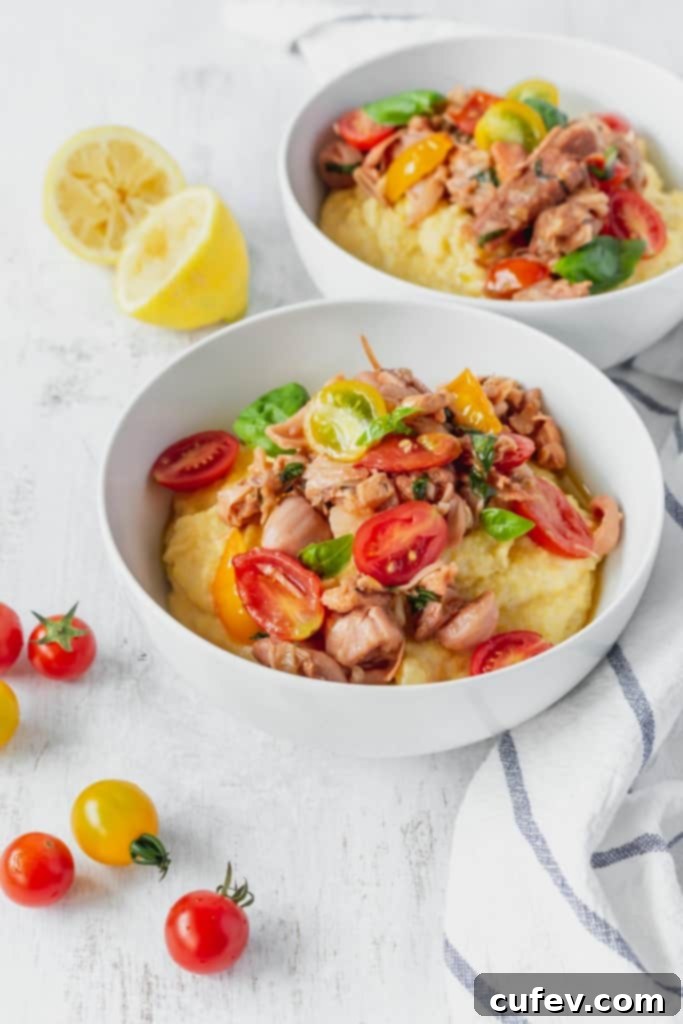 This vegan grits recipe is the perfect gluten-free meal! Creamy vegan polenta cooked in coconut milk is topped with savory jackfruit confit with tomatoes and basil!