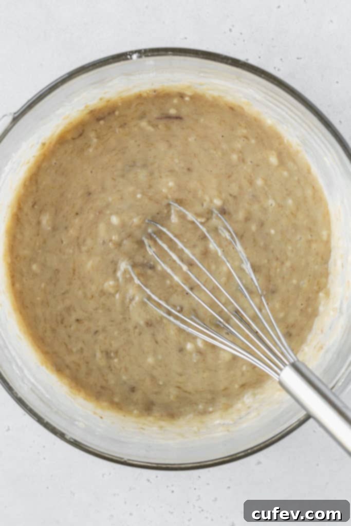 Close-up of freshly mixed banana cupcake batter, ready for scooping.