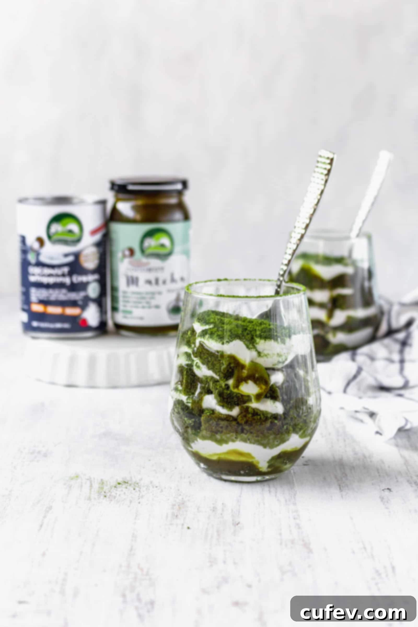 Vegan matcha tiramisu is a Japanese twist on a classic Italian dessert! This recipe has layers of matcha cake, matcha sauce, and coconut whipped cream! #matchadessert #vegantiramisu #matchatiramisu #vegandessert #coconutwhippedcream