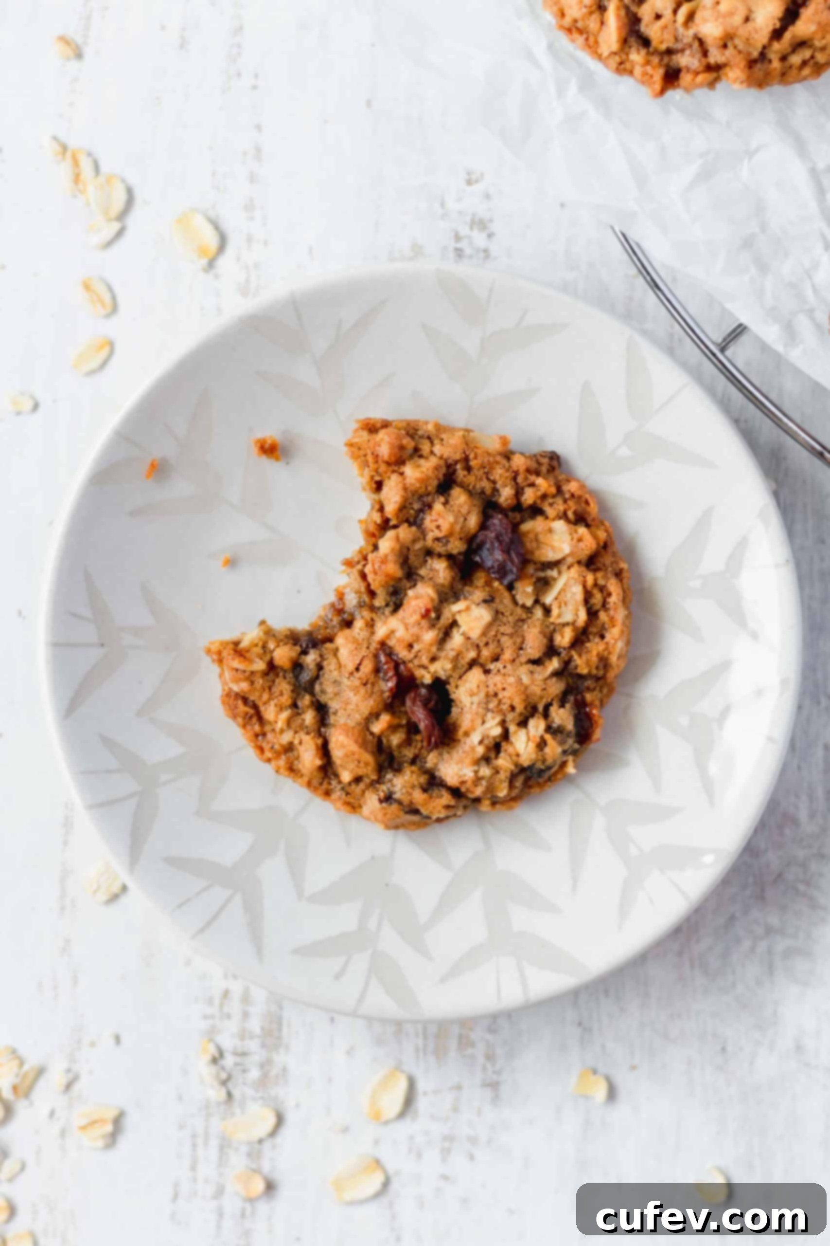 A bitten cookie on a plate