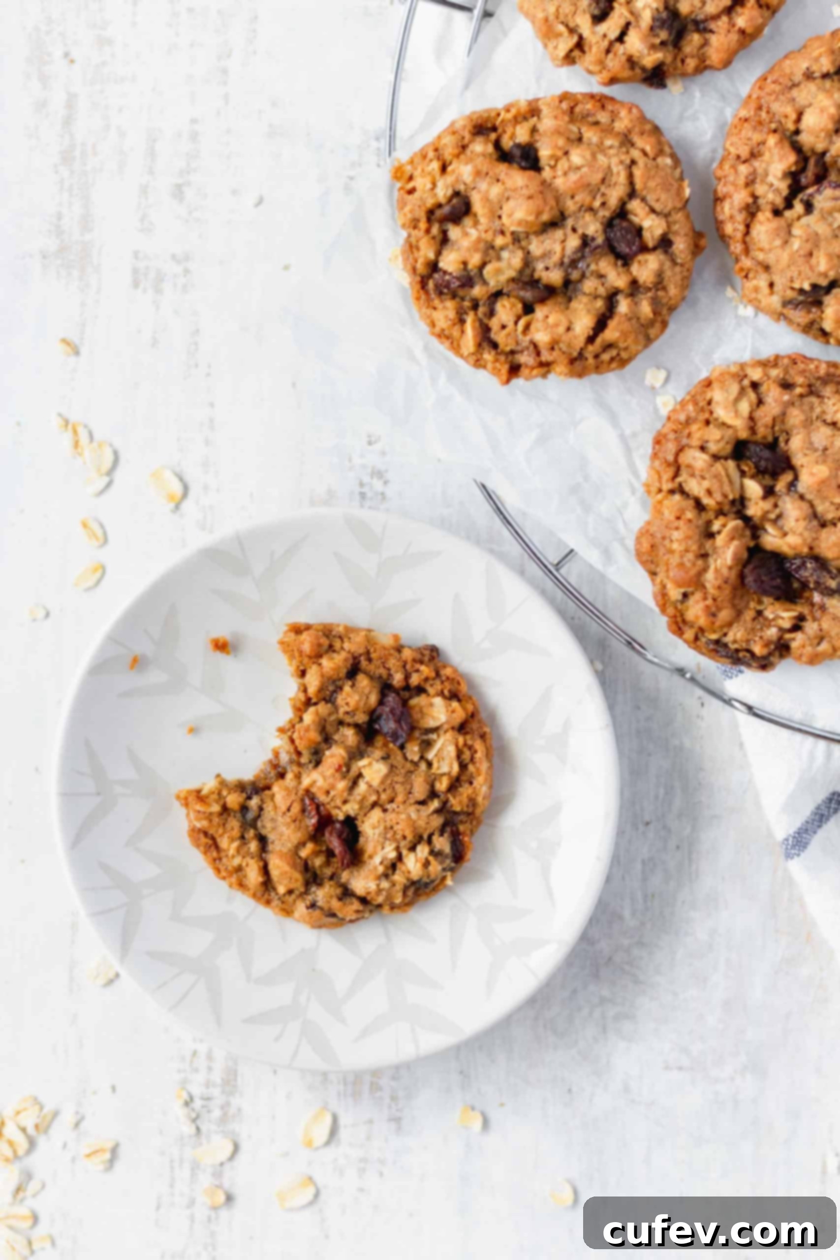 These chewy oatmeal raisin cookies are irresistible! Browned butter, brown sugar, cinnamon, and nutmeg make these cookies soft and delicious! #oatmealcookies #oatmealraisin #cinnamon #nutmeg #rolledoats