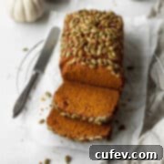A sliced loaf of gluten free pumpkin bread.
