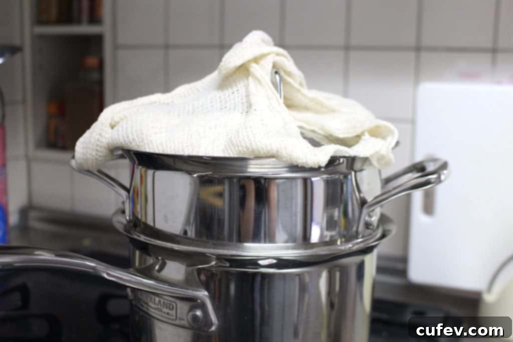 Steamer with cheesecloth-lined sticky rice, a traditional Thai cooking method