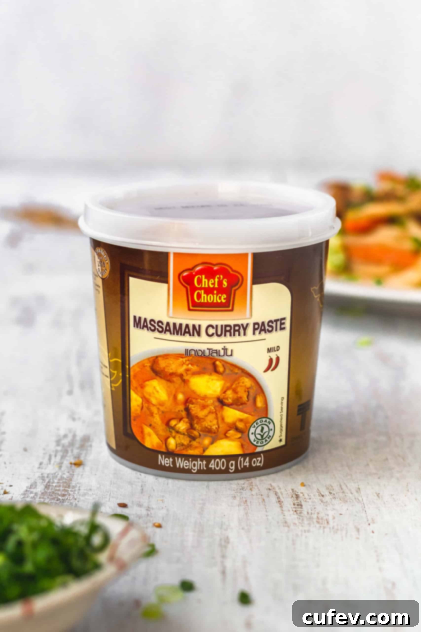 A tub of Chef's Choice massaman curry paste, a key ingredient for infusing rich Thai flavors into the vegan yaki udon.