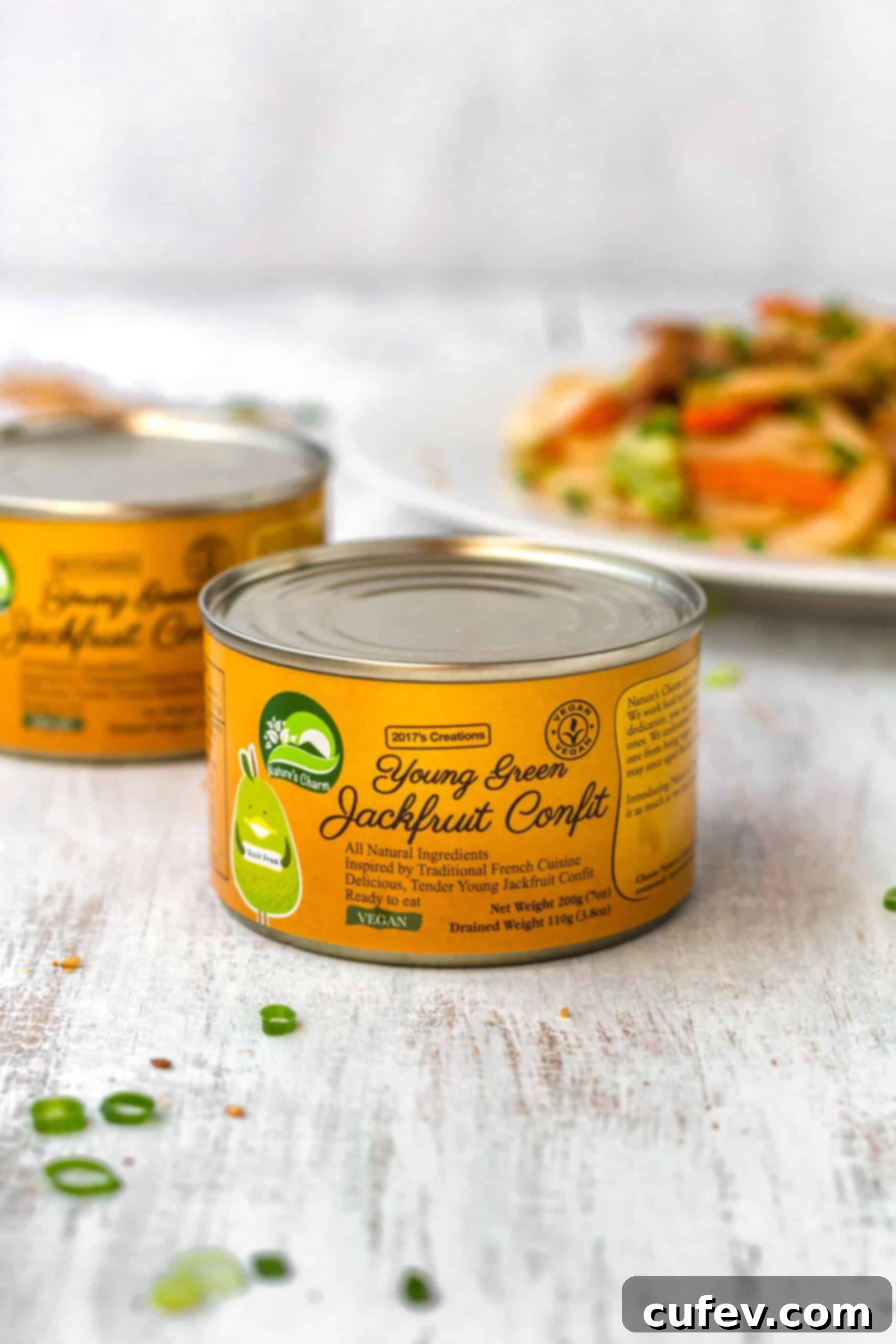 Cans of Nature's Charm young green jackfruit confit, packaged and ready for use in vegan recipes.