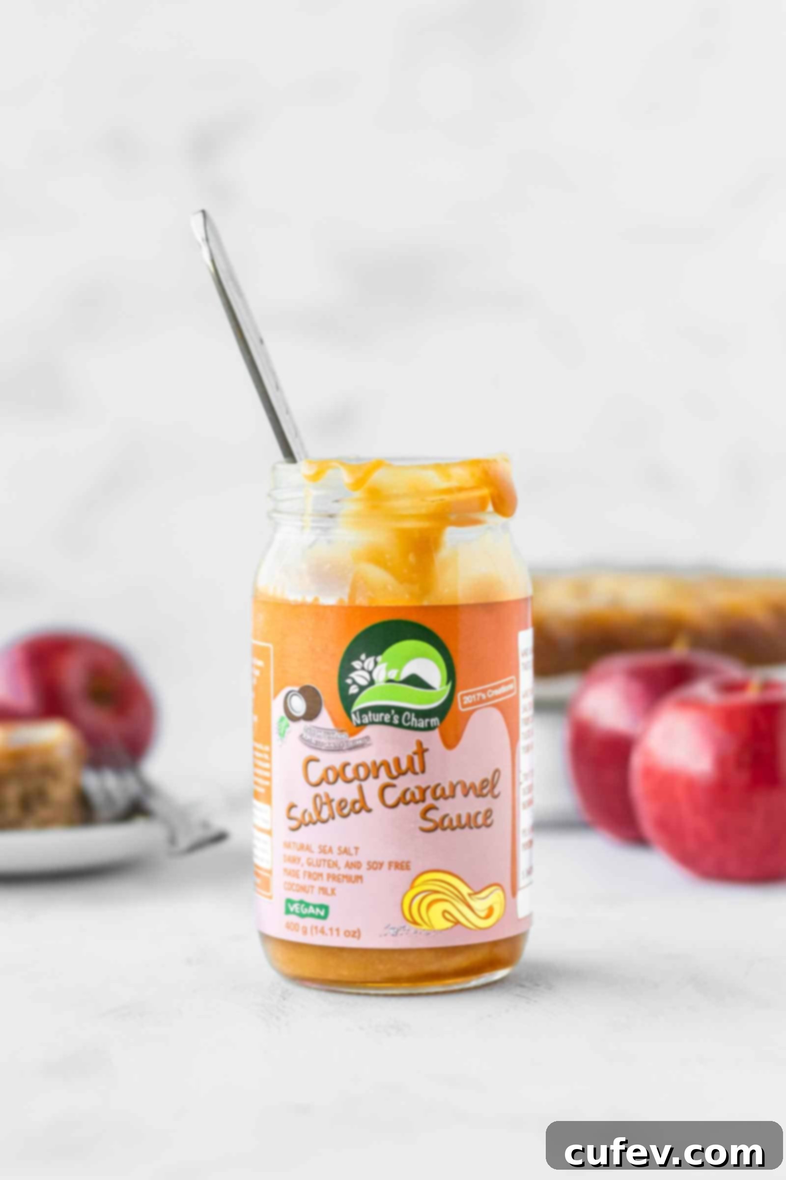 A jar of Nature's Charm vegan salted caramel sauce, ready to be used as a delicious topping.