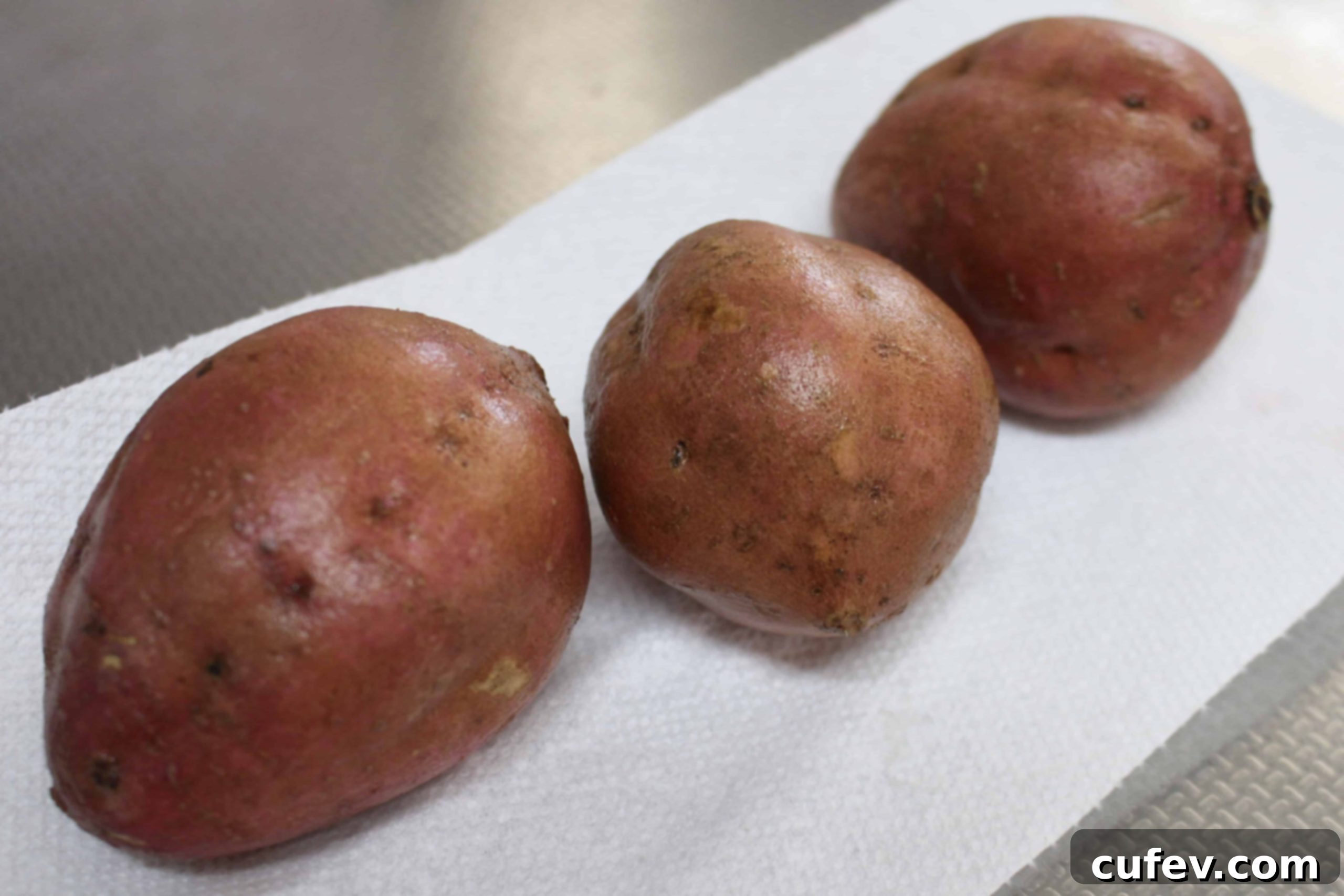 Freshly washed Japanese sweet potatoes, ready for roasting.