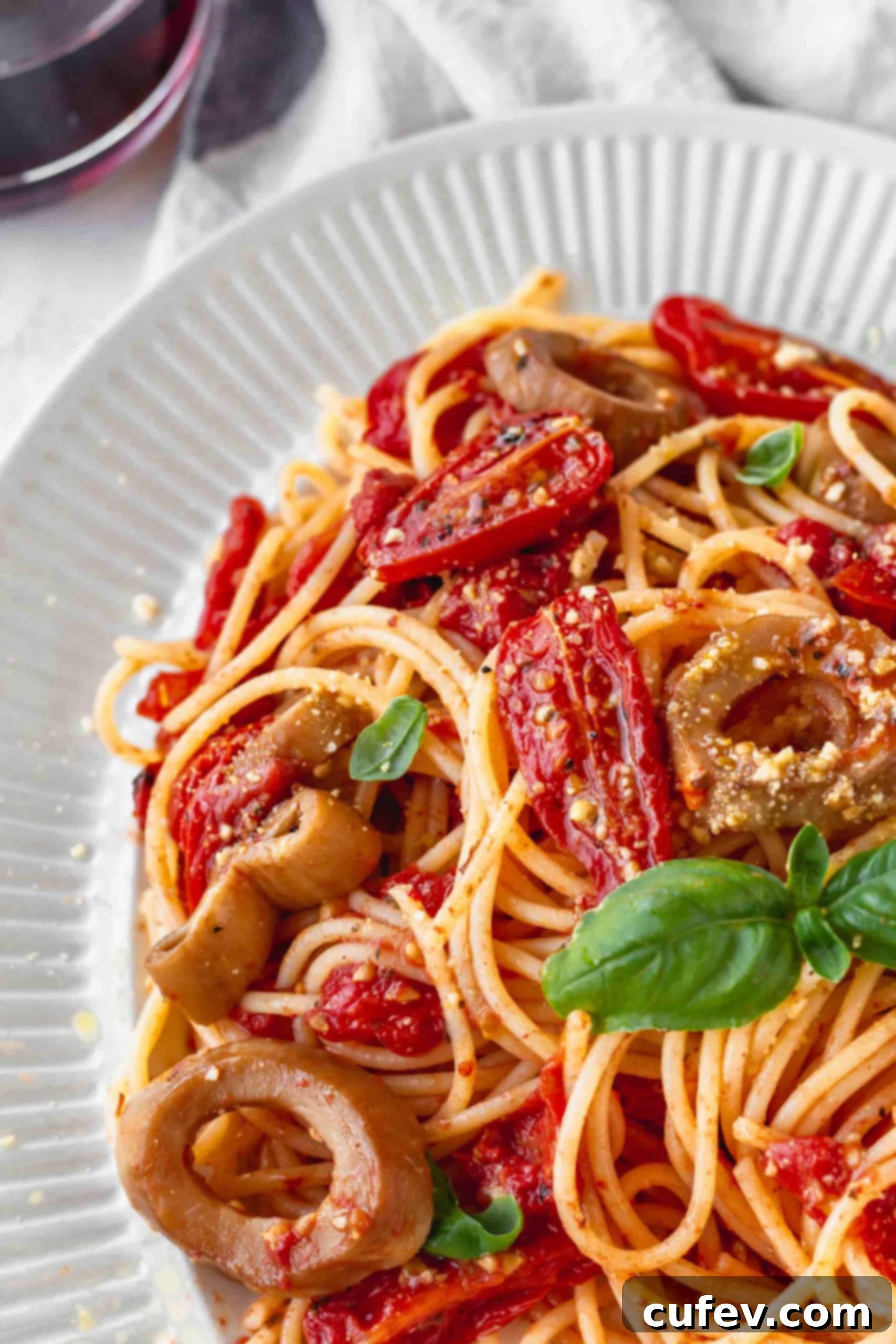 Vegan Calamari and Burst Tomato Pasta 5 Close up of gluten-free spaghetti with roasted cherry tomatoes
