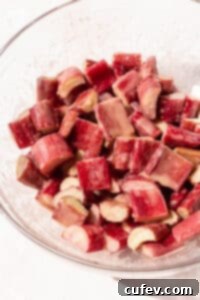 Rustic Rhubarb Crisp Gluten Free 6 Closeup shot of chopped rhubarb after mixing with sugar and cornstarch.