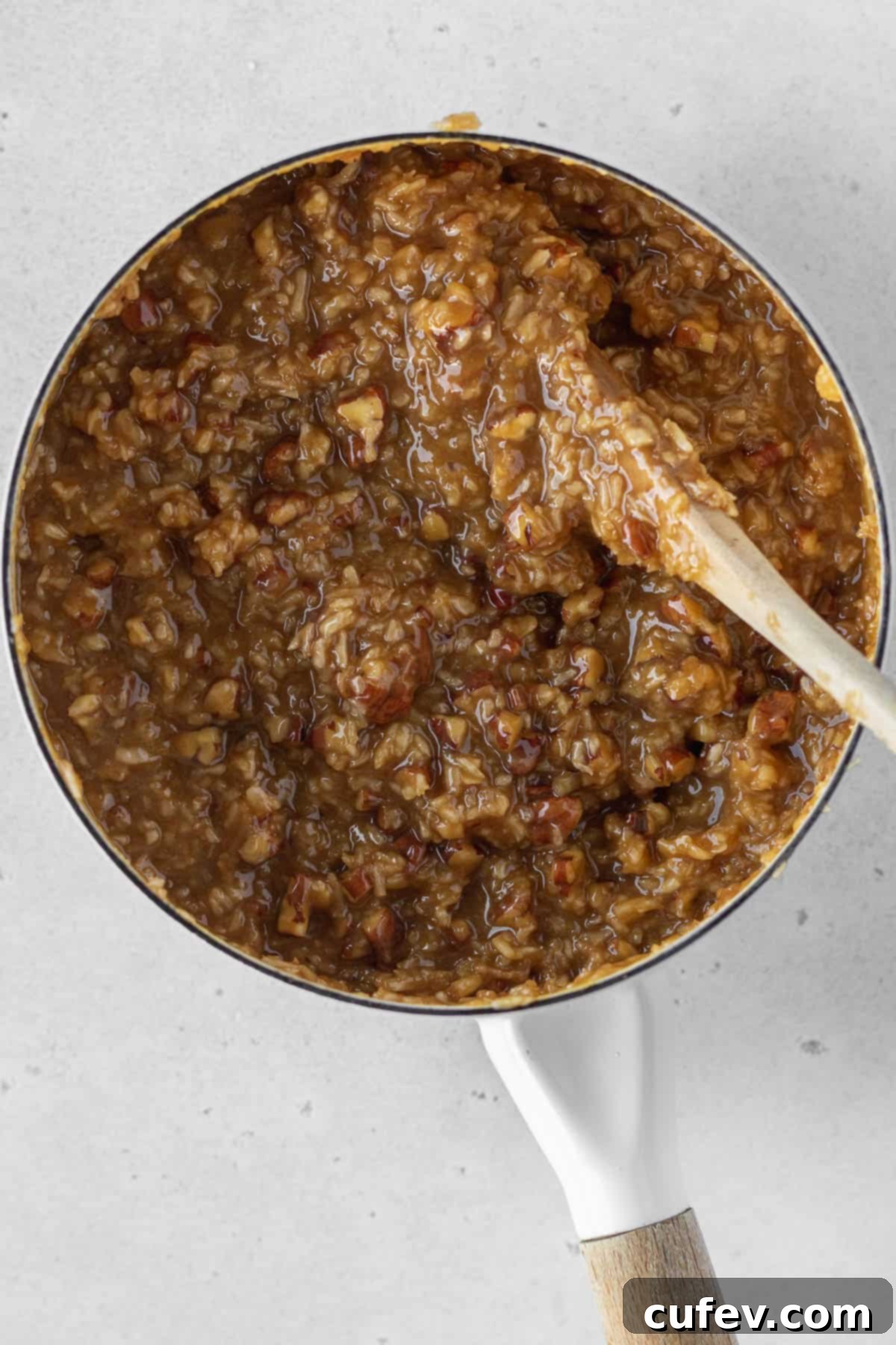 Dairy-free German chocolate cake frosting in a saucepan.