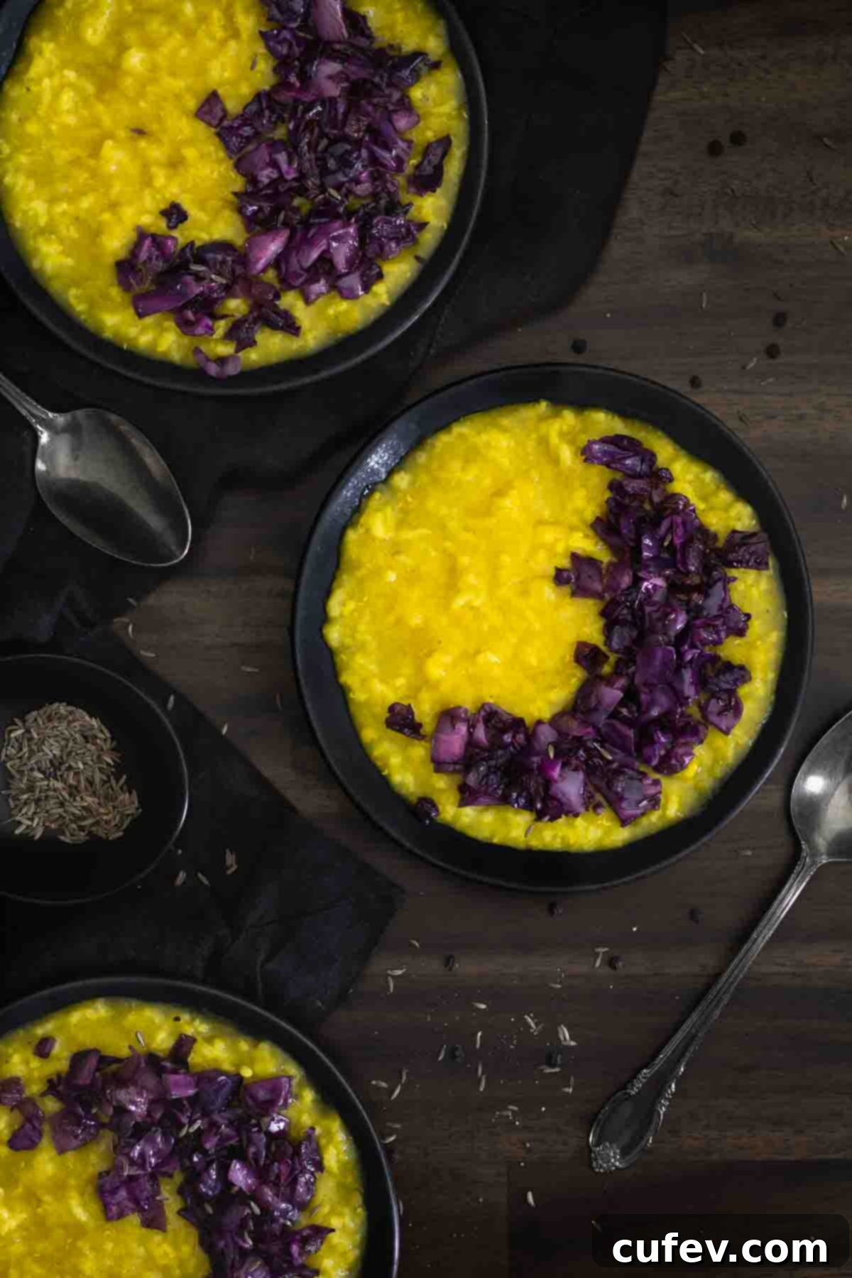 Khichdi with vibrant red cabbage and onions, garnished with fresh herbs, showcasing a wholesome and colorful meal.