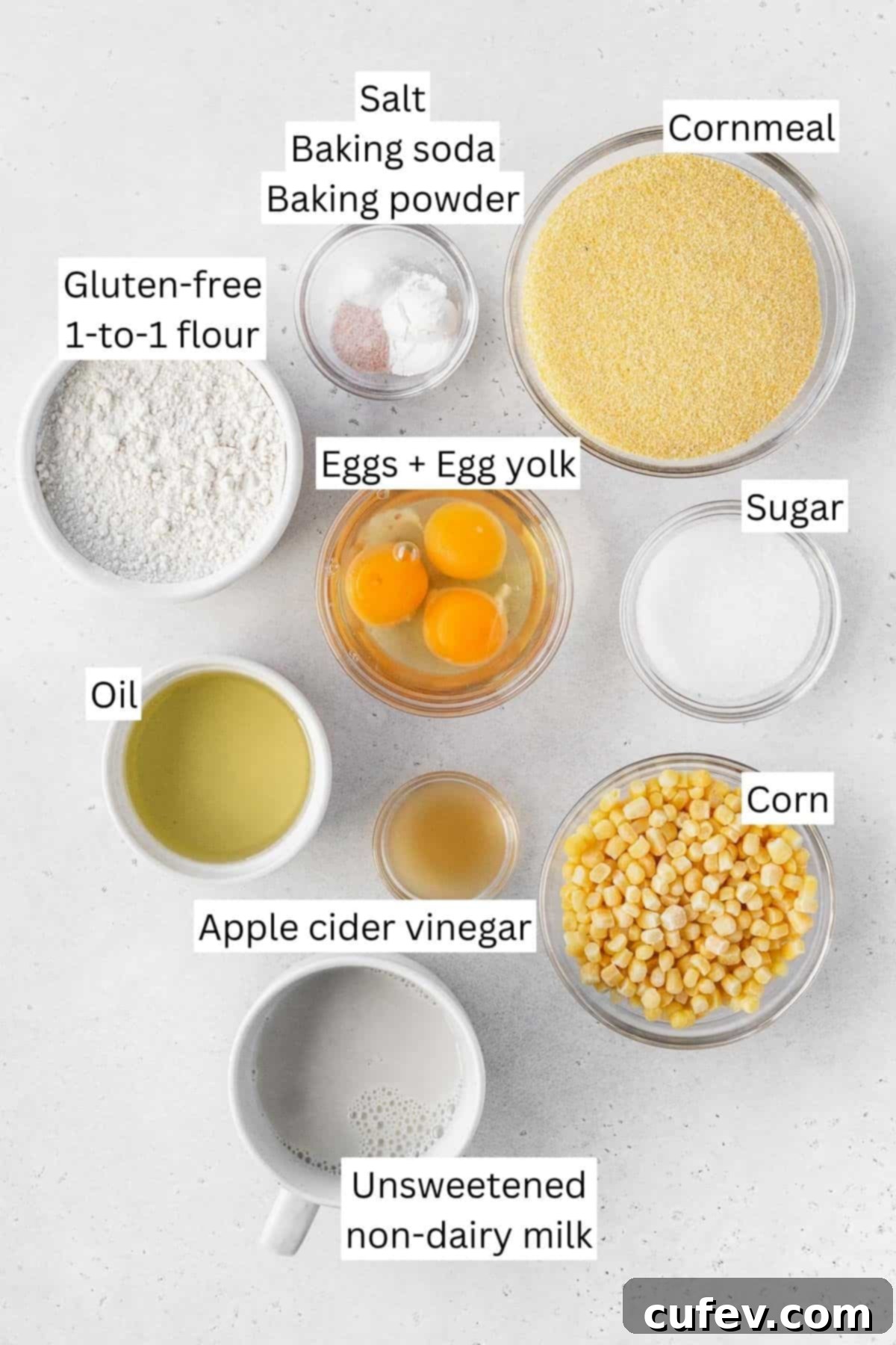 Golden Gluten-Free Cornbread Delight 3 Ingredients for making dairy-free gluten-free cornbread measured out into bowls on a white table with text overlay.