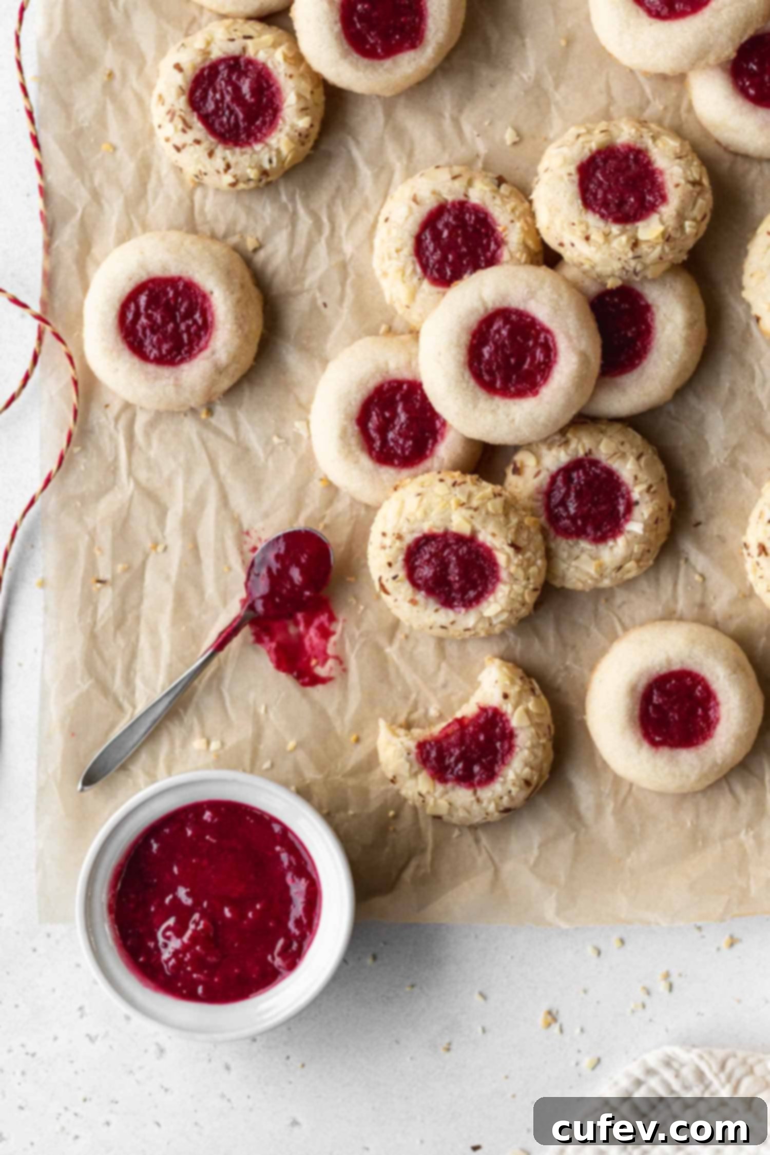 Cranberry cookies stacked on parchment paper