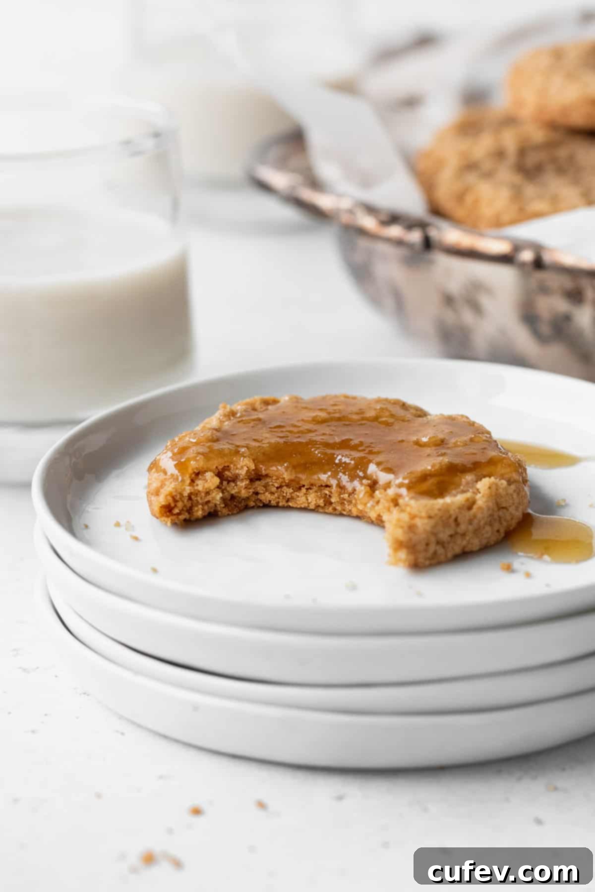 Perfectly Chewy Gluten-Free Ginger Cookies 14 A gluten free ginger snap with a bite taken out.