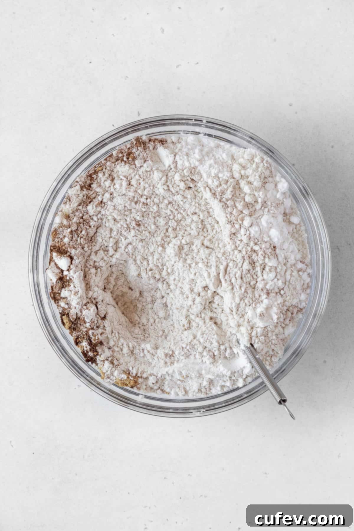 Perfectly Chewy Gluten-Free Ginger Cookies 7 Flour and spices mixed together in a bowl.