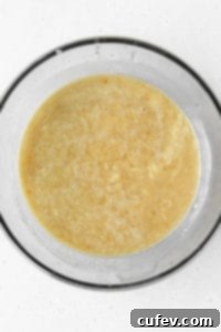 A bowl of wet ingredients for banana bread