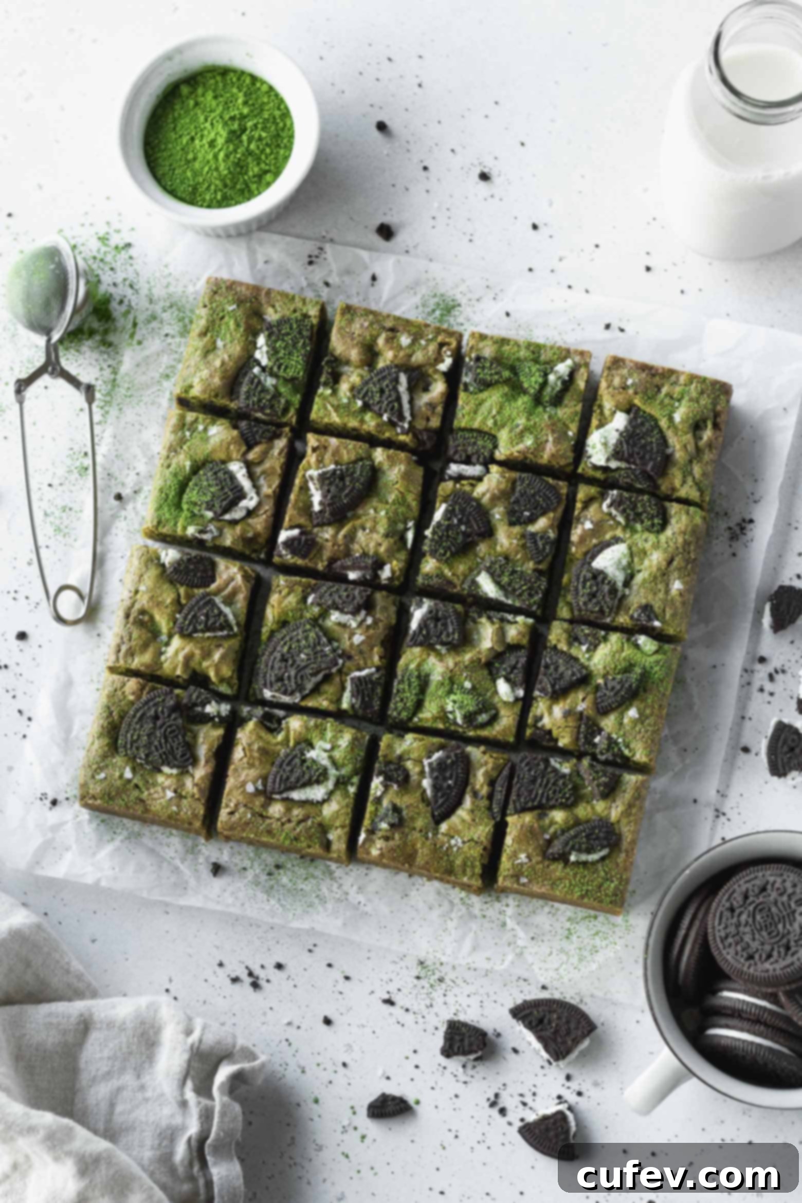 Perfectly cut squares of vibrant green matcha Oreo blondies, showcasing their fudgy texture and cookie pieces.