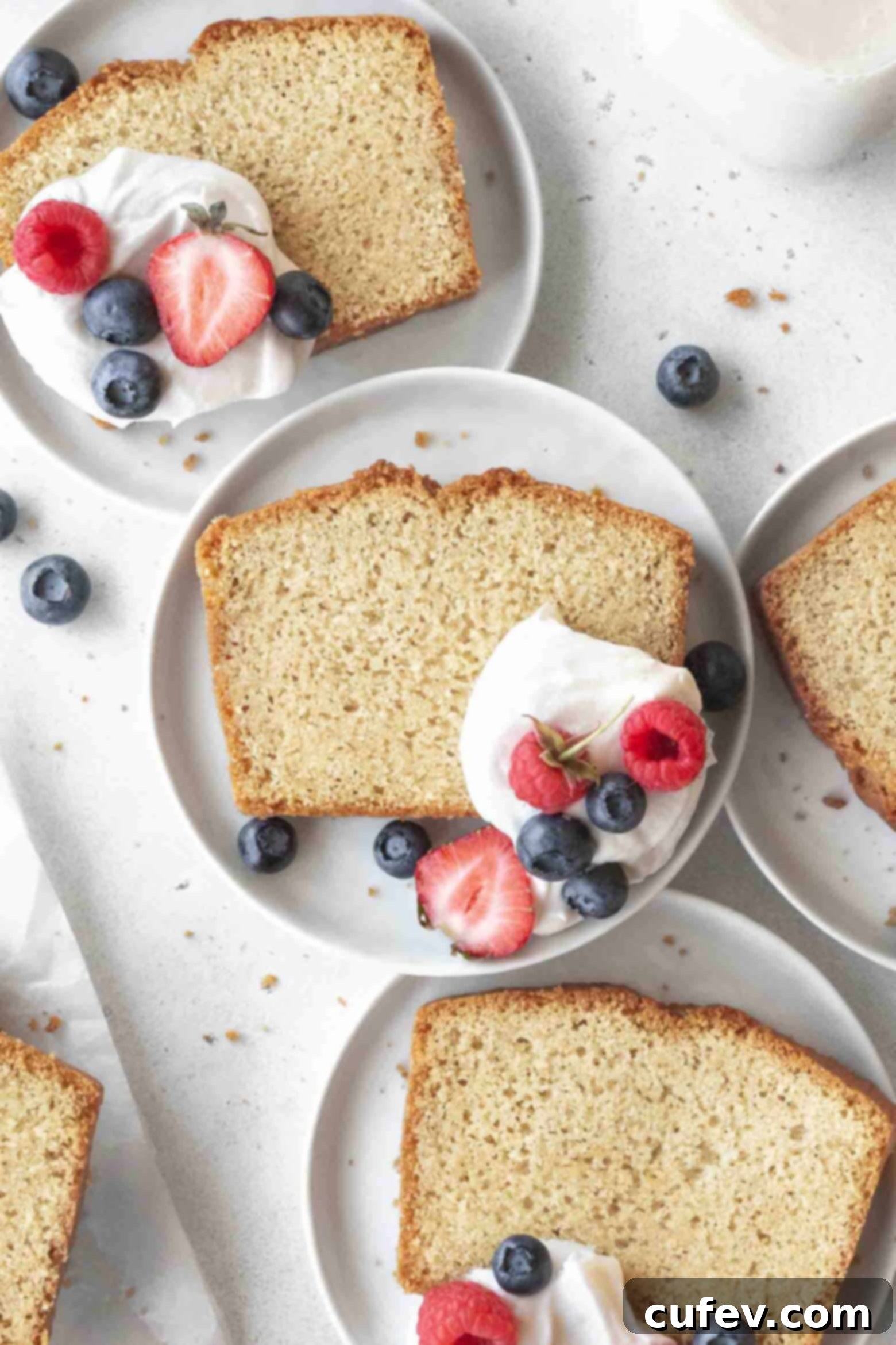 Close-up of tender gluten-free pound cake slices on plates, showing a beautiful crumb.