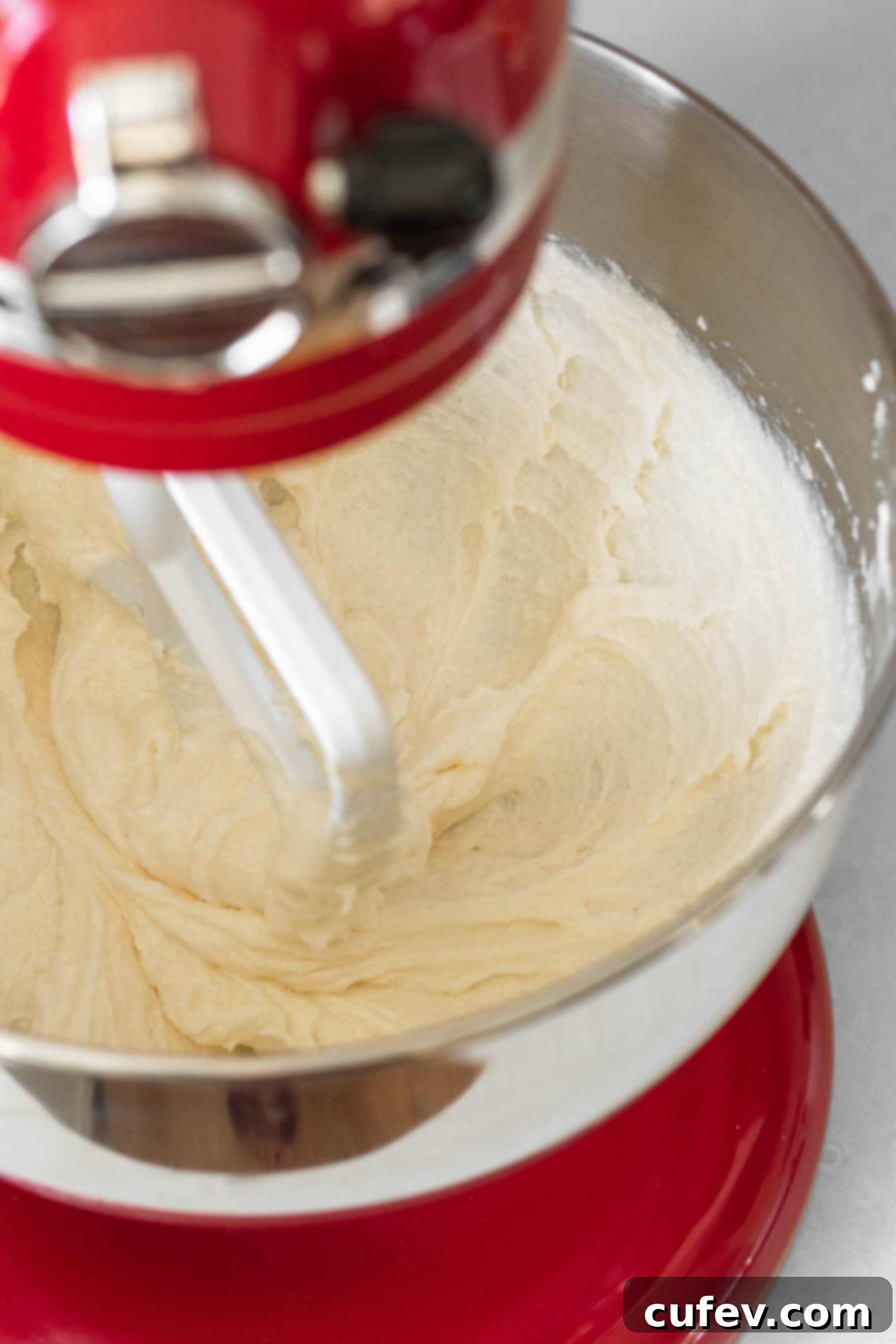 Cream the butter and sugar in the bowl of a stand mixer.