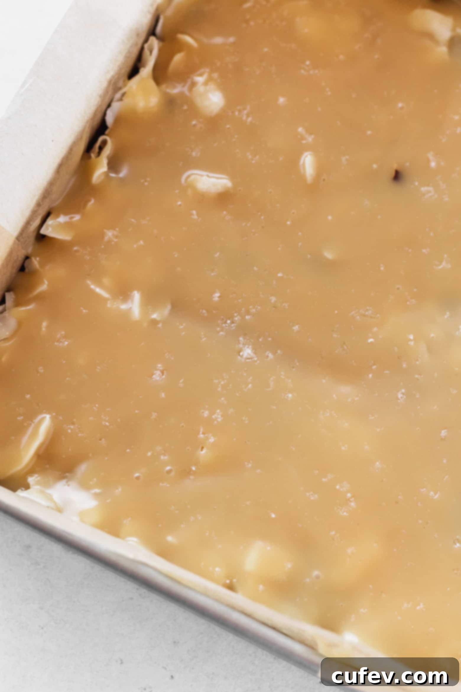 Sprinkling flaky sea salt over the vegan sweetened condensed milk layer before baking.