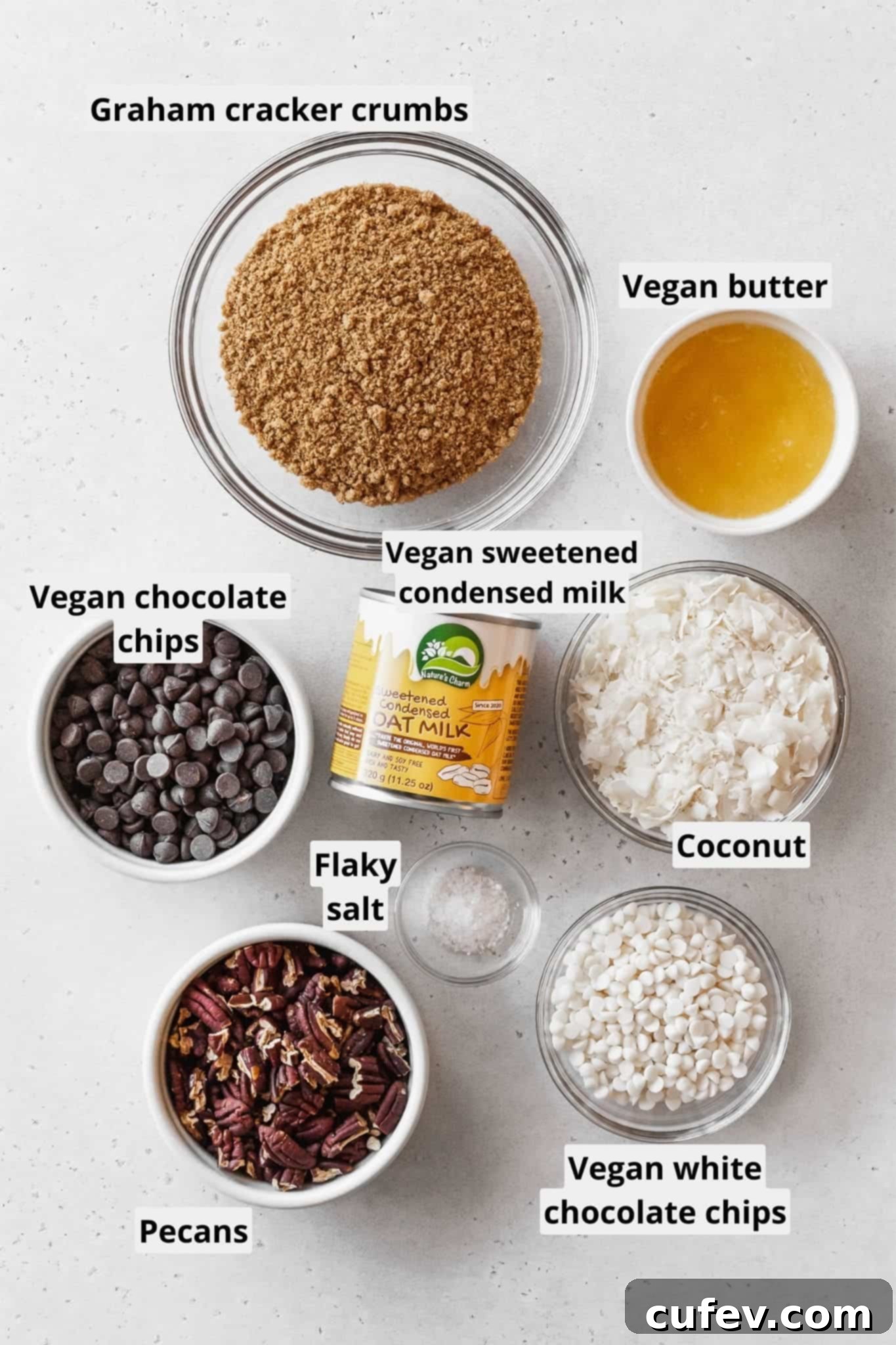 A colorful array of ingredients for making vegan magic bars, neatly laid out.
