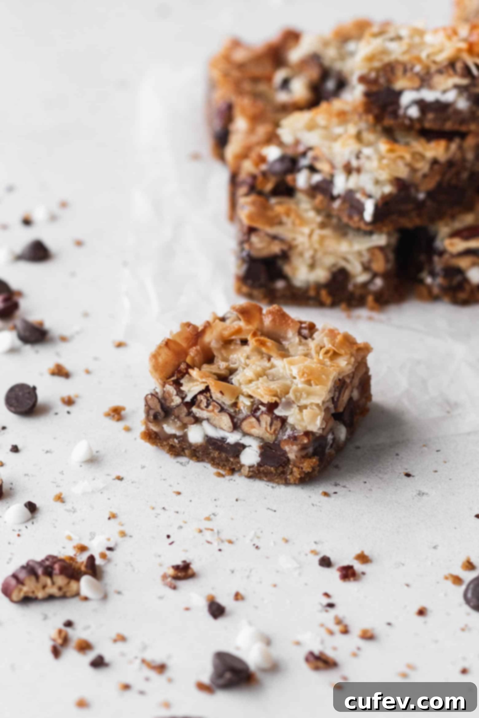 A single square of vegan magic bar, showcasing its moist, layered texture.