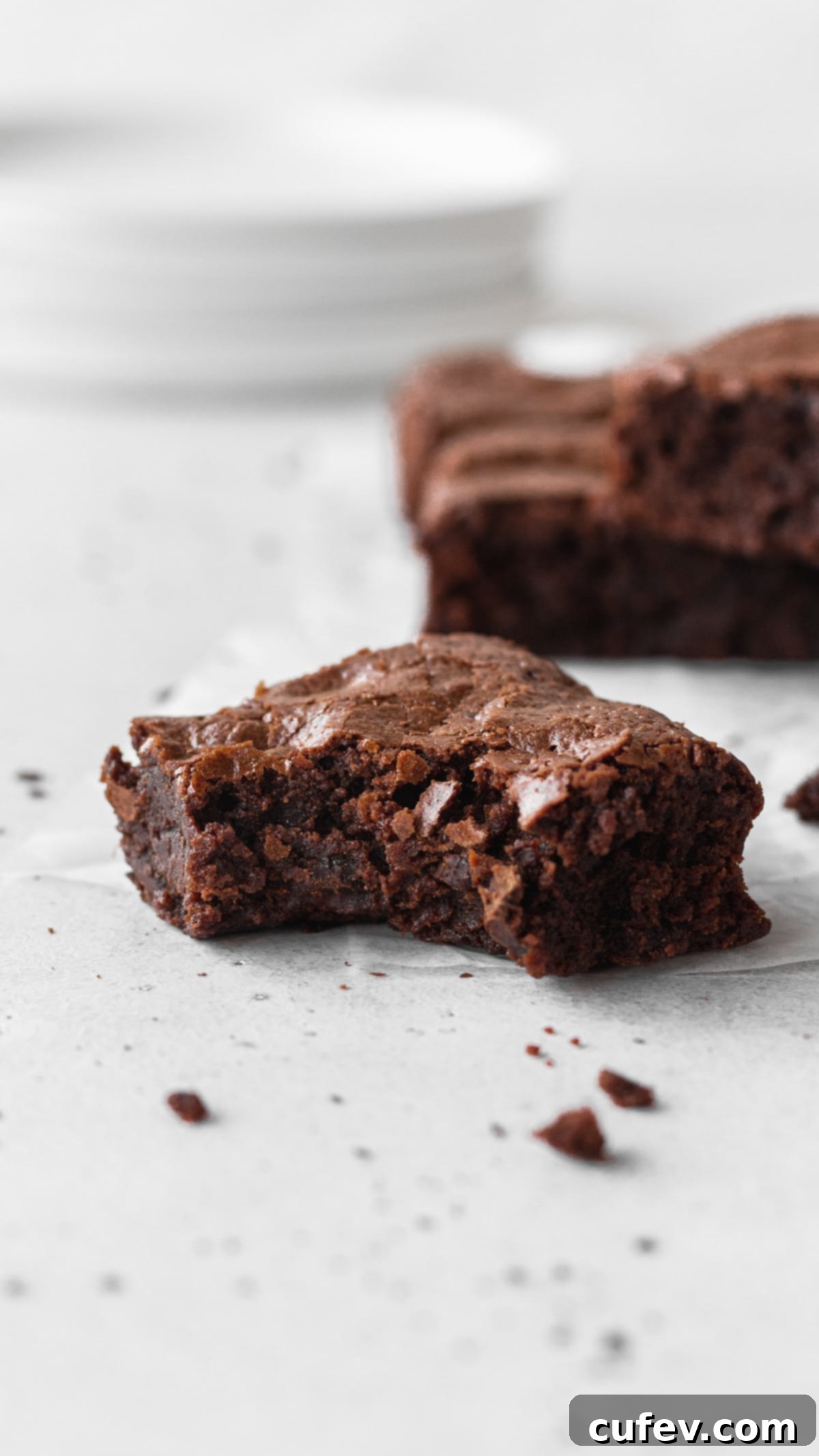 Gluten free brownie with a bite taken out of it.