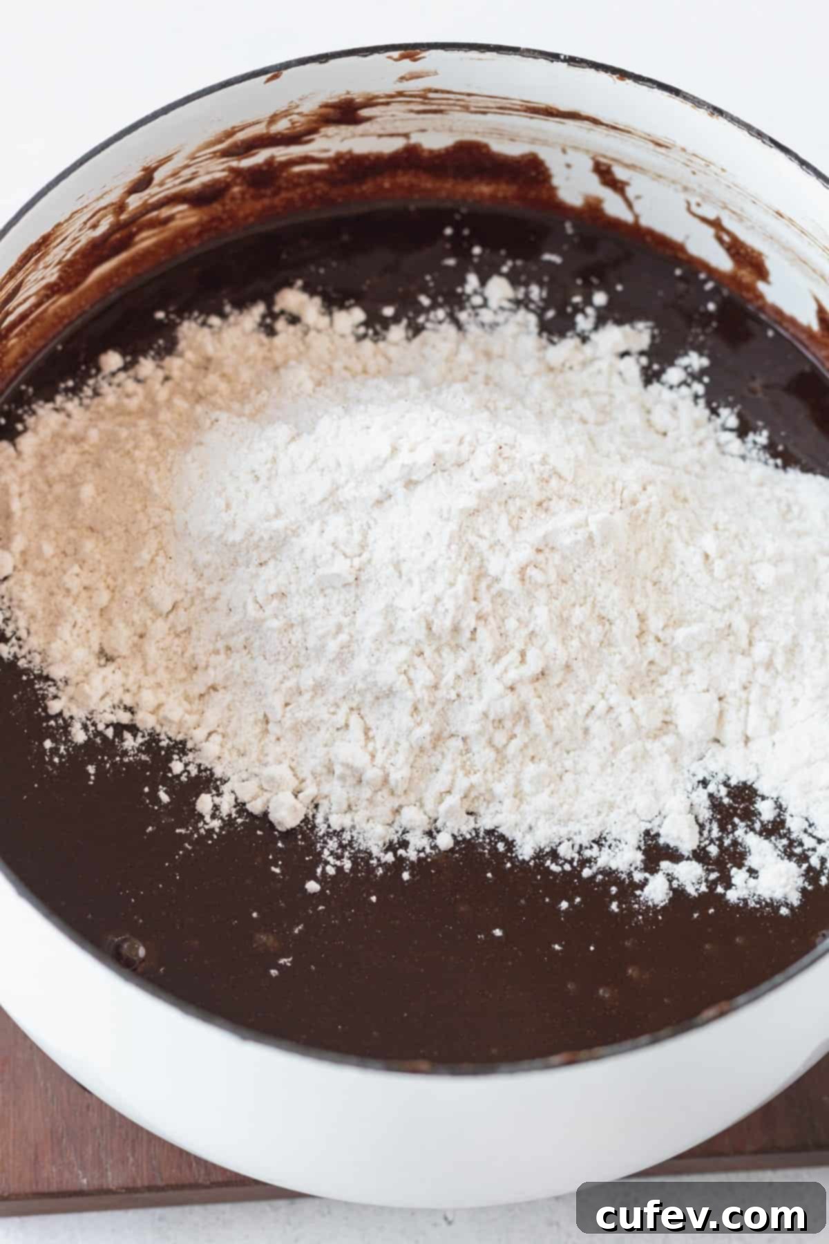 Dry ingredients added to GF brownie batter.