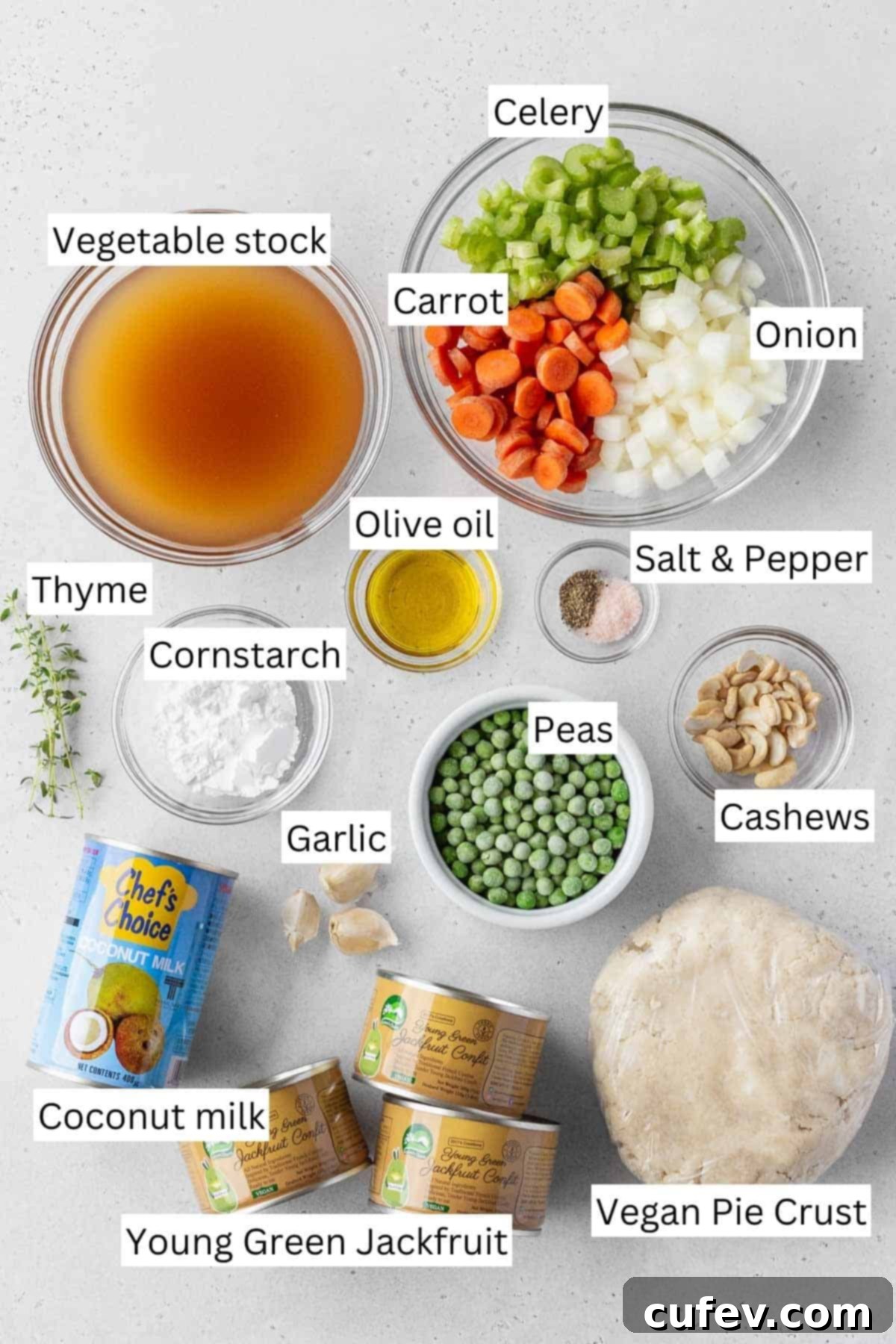 A collection of measured ingredients for vegan chicken pot pie, neatly arranged in small bowls, ready for cooking.
